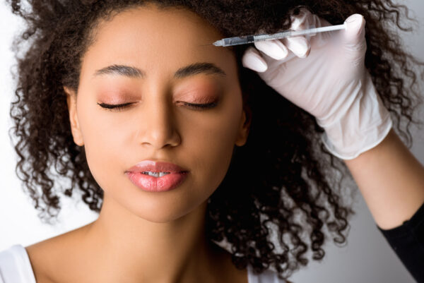 Botox, or Botulinum Toxin, is a popular in-office skincare treatment that temporarily reduces fine lines, wrinkles, and textural indents from pitting and acne scars. 